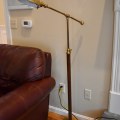 DL02. Brass and wood floor lamp with clamshell shade. 